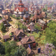 A Farthest Frontier screenshot, showing a sprawling rural village, with graveyard and town center.